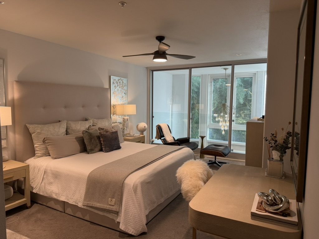 Master bedroom with king bed and ceiling fan